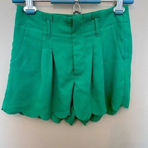 Scalloped, high waisted, pleated shorts